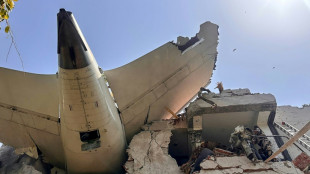 Flames and smoke in aftermath of crashed India passenger jet