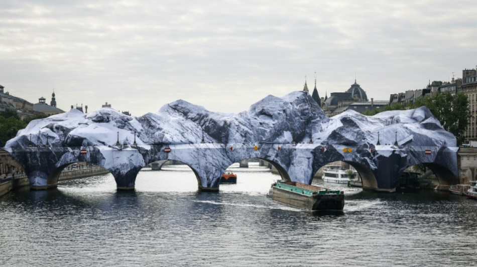 'French Banksy' and Daft Punk star turn Paris bridge into Alpine cave