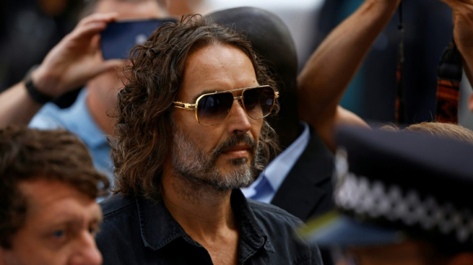 UK comedian Russell Brand appears in court on rape charges